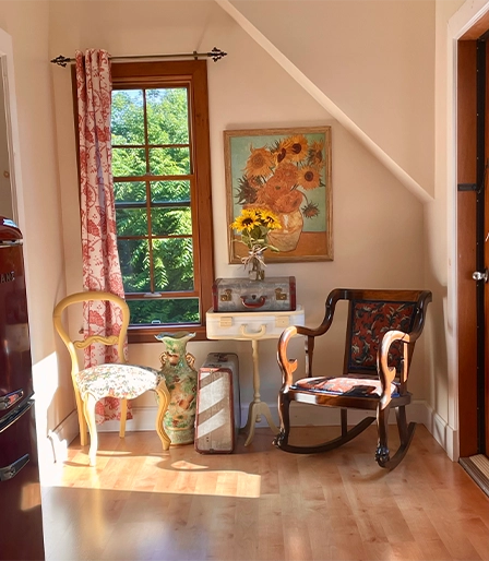 Guest room reading corner with antique chairs